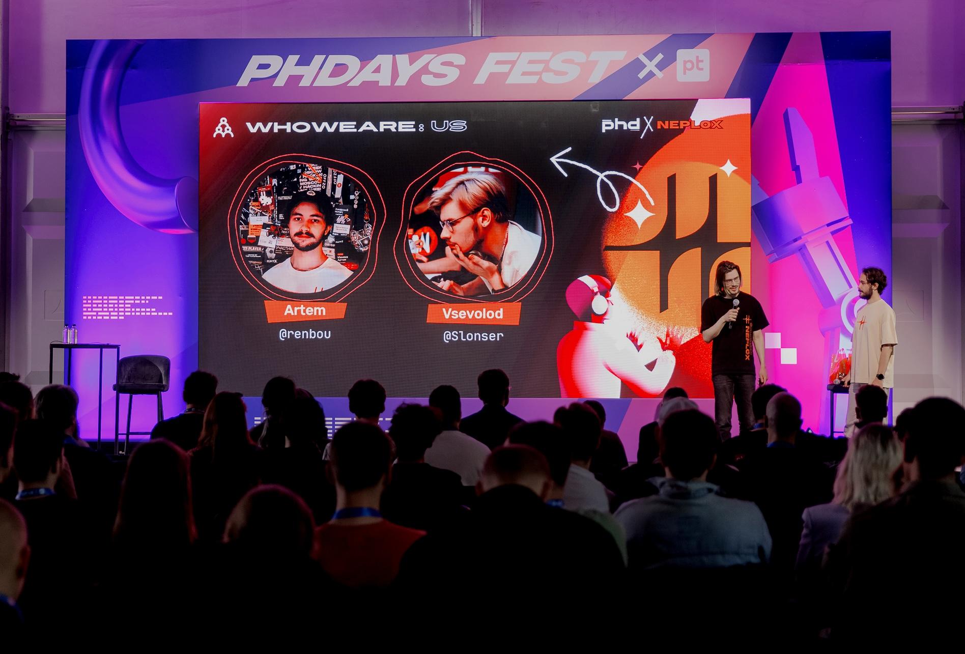 Artem and Vsevolod giving a talk about attacks on crypto wallets at PHDays Fest